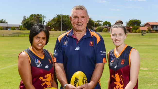 SMOSH West Lakes women’s coach Greg Phillips, pictured with players Bronwyn Davey and Remy Grant, has led the Lions to the division one grand final in their inaugural season. Picture: AAP/Brenton Edwards