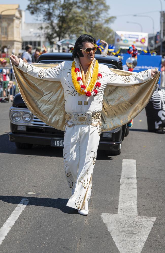 Elvis impersonator Tristan James walks in front of the Bone Idol float in the Grand Central Floral Parade of the Carnival of Flowers, Saturday, September 21, 2024. Picture: Kevin Farmer