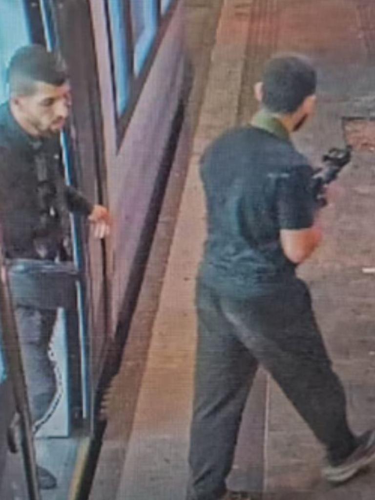 A gun could be seen on at least one of the men as they left the tram. Picture: Twitter/X.