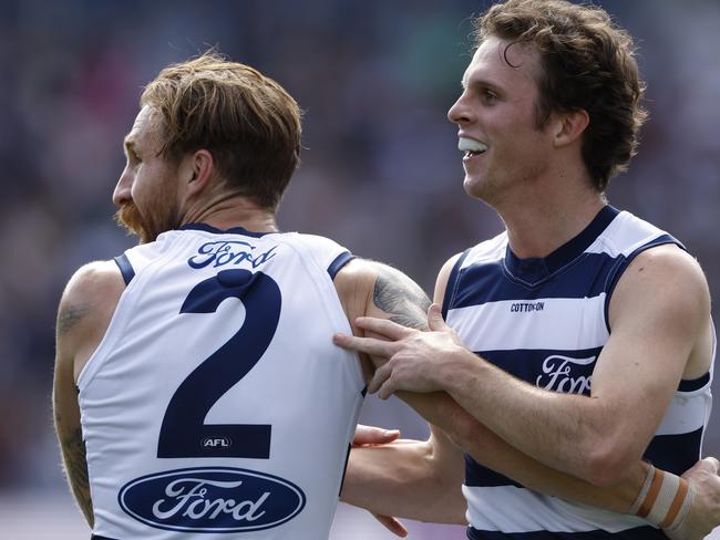 GEELONG, AUSTRALIA - APRIL 14: Max Holmes of the Cats celebrates a goal during the round five AFL match between Geelong Cats and North Melbourne Kangaroos at GMHBA Stadium, on April 14, 2024, in Geelong, Australia. (Photo by Darrian Traynor/Getty Images)