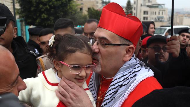 Pizzaballa wears a keffiyeh during Christmas celebrations at the Church of Nativity in Bethlehem, on the West Bank in 2023. Picture: Getty Images