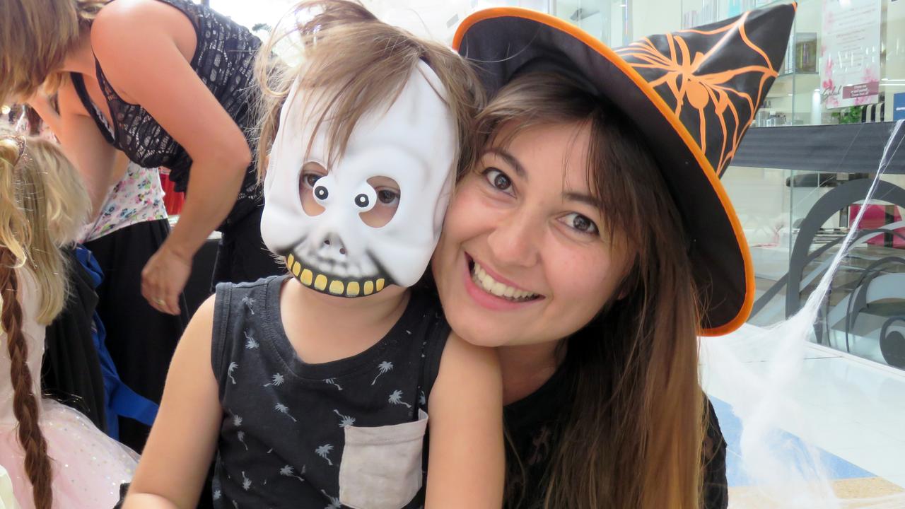 Angelique and River Lee, 4, decorating a trick-or-treat bag.