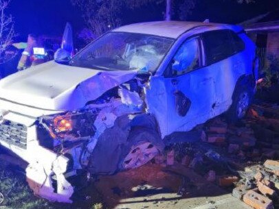 A man has lost his licence on the spot after crashing into a poll before his car smashed through a brick fence overnight. Picture: SA Police