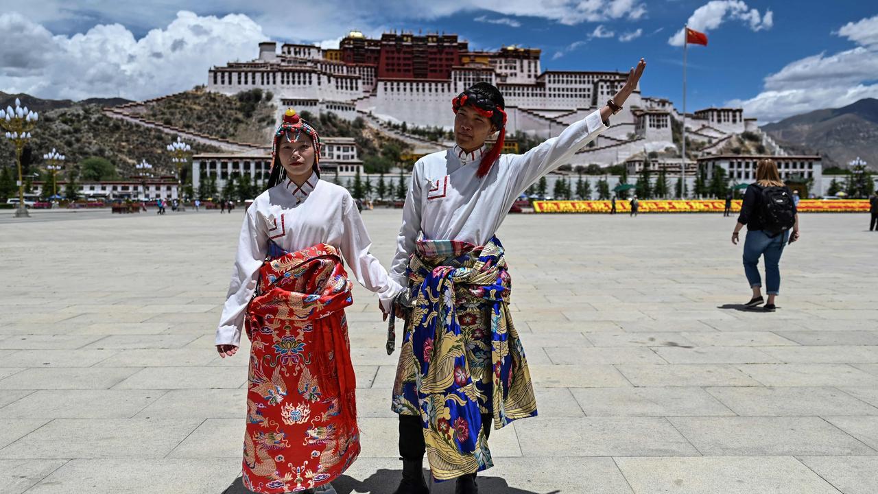 Thirty-five million tourists flooded into the region last year, ten times the entire population of Tibet. Picture: Hector Retamal /AFP