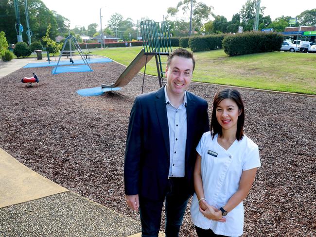 Parramatta councillor Andrew Jefferies and Carlingford Pharmacy owner Susan Nguyen in a park across from a shopping centre to soon be transformed into a car park Carlingford. Picture: Angelo Velardo