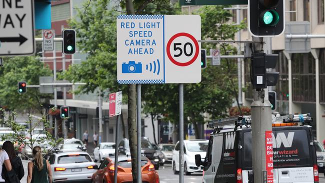 A permanent speed camera warning sign on William Street in Darlinghurst. Picture: Richard Dobson