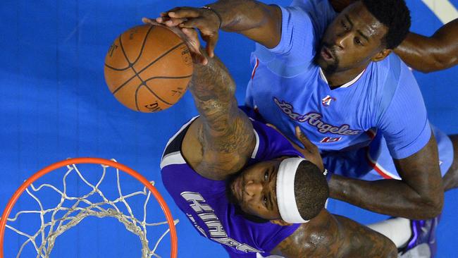 Sacramento Kings centre DeMarcus Cousins grabs a rebound away from Los Angeles Clippers centre DeAndre Jordan.