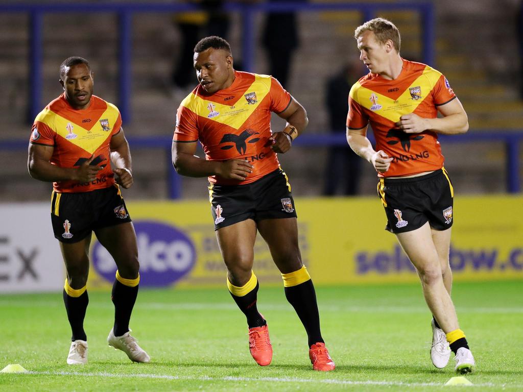 Edwin Ipape and Kyle Laybutt of Papua New Guinea warm up prior to the Rugby League World Cup 2021 match against Cook Islands. Picture: Getty Images for RLWC)