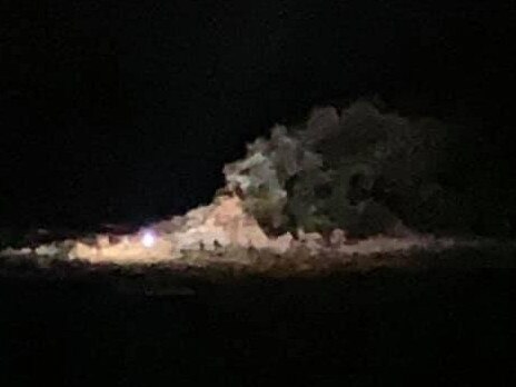 A police helicopter used a powerful searchlight to look for a man off Shelly Headland who dived into the water at Manly to escape police. Picture: Facebook