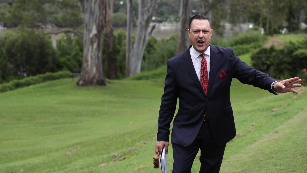 Jason Adcock mid-auction at a property in Indooroopilly. Picture: Annette Dew.