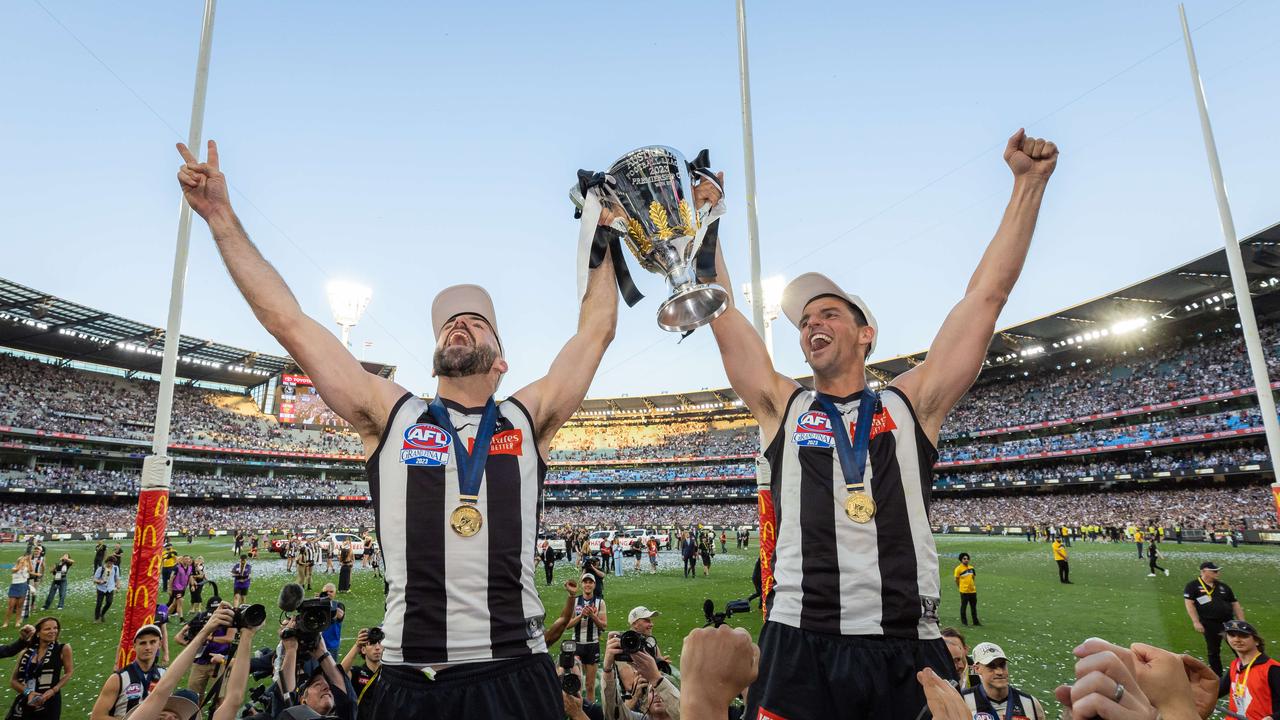 MELBOURNE , AUSTRALIA. September 30, 2023. AFL Grand Final between Collingwood and the Brisbane Lions at the MCG. After the siren, Collingwood wins. Steele Sidebottom and Scott Pendlebury. Picture by Jason Edwards