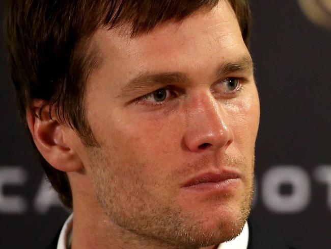 DENVER, CO - JANUARY 24: Tom Brady #12 of the New England Patriots speaks in a post game press conference after being defeated by the Denver Broncos in the AFC Championship game at Sports Authority Field at Mile High on January 24, 2016 in Denver, Colorado. The Broncos defeated the Patriots 20-18. Doug Pensinger/Getty Images/AFP == FOR NEWSPAPERS, INTERNET, TELCOS & TELEVISION USE ONLY ==