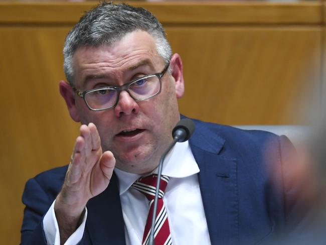 Labor Senators Murray Watt (left) speaks to Secretary of the Department of Home Affairs Michael Pezzullo during a Senate Inquiry at Parliament House in Canberra, Wednesday, September 5, 2018. The Senate legal affairs committee is examining whether Minister for Home Affairs Peter Dutton misused his ministerial discretion to grant two European au pairs visas in 2015, despite the reservations of border authorities. (AAP Image/Lukas Coch) NO ARCHIVING