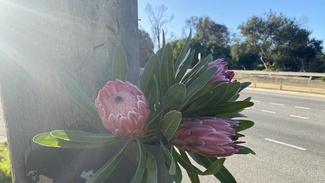 Flowers left near the scene where Mrs Locco was riding when she was struck.