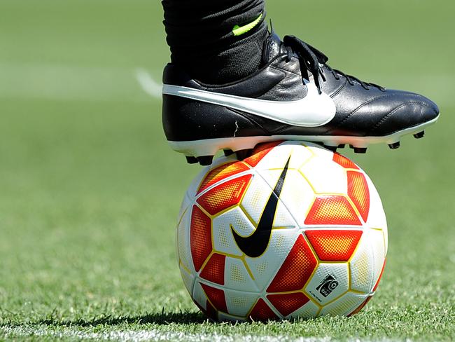 Generic photo of a trainer and ball, during the team training session at the Collingwood Training Centre, Olympic Park in Melbourne, Saturday, Jan. 3, 2014. Australia will play Kuwait in the AFC Asian Cup tournament opening match, in Melbourne in 6 days. (AAP Image/Joe Castro) NO ARCHIVING