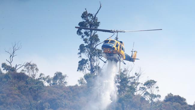 Helicopter dumping water. Bushfire in Dynnyrne threatening homes. Picture: Nikki Davis-Jones