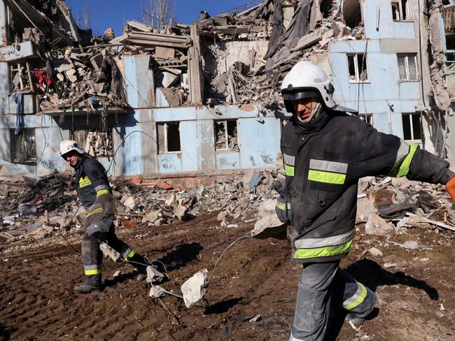 Ukrainian rescuers remove debris from the five-storey residential building destroyed after a missile strike in Zaporizhzhia amid the Russian invasion of Ukraine. Picture: AFP