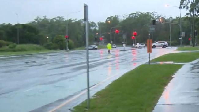 Police closed Worongary Road at Mudgeeraba due to flash flooding. Picture: 9 News