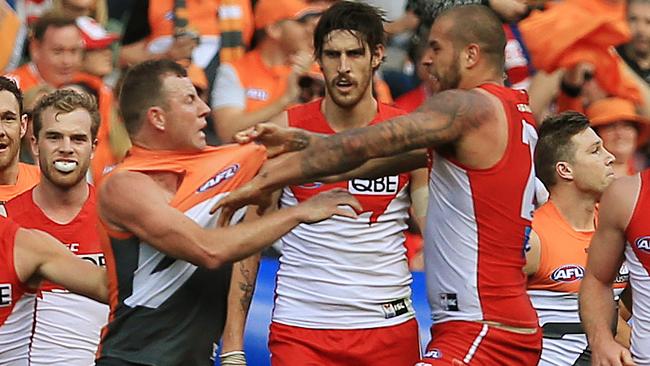 Steve Johnson and Buddy Franklin scuffle at quarter-time. Picture: Toby Zerna