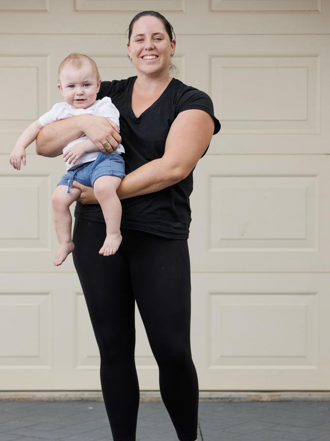 Former Olympic swimmer Alicia Coutts at home in Wellington Point with her youngest sons Mason, 14 months. Picture Lachie Millard