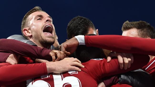 LIverpool player Jordan Henderson and teammates celebrate reaching the Champions League final with a semi-final win over Barcelona at Anfield. Picture: Paul Ellis/AFP