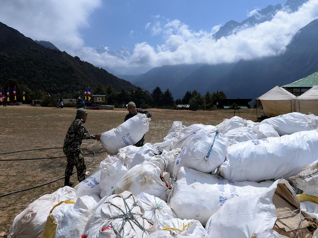 Nepali Army personnel collect waste from Mount Everest at Namche Bazar in Solukhumbu district. Picture: Prakash Mathema/AFP