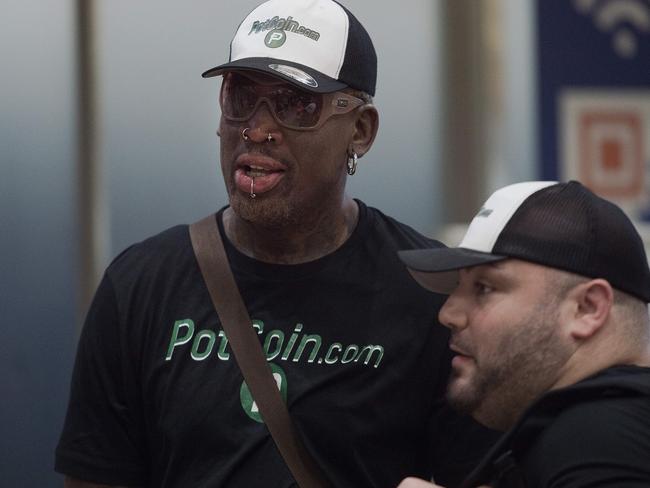 Dennis Rodman as he walks out from the arrival gate returning from his trip to North Korea at Beijing's international airport. Picture: AFP