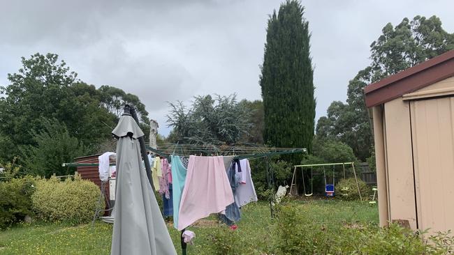 In the backyard of the home there is a child’s swing set and many pink toys including a scooter. Picture: Brianna Travers