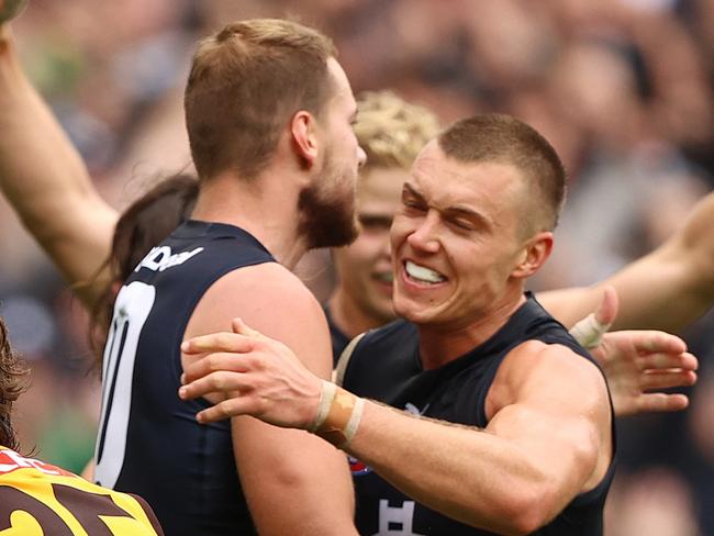 MELBOURNE, AUSTRALIA - APRIL 03: The Blues celebrates on the siren after the they defeated the Hawks during the round three AFL match between the Carlton Blues and the Hawthorn Hawks at Melbourne Cricket Ground on April 03, 2022 in Melbourne, Australia. (Photo by Robert Cianflone/Getty Images)