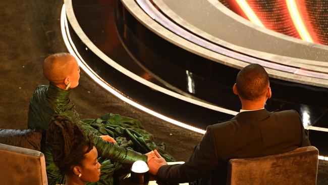 The couple held hands after the shocking incident. Picture: Robyn Beck / AFP