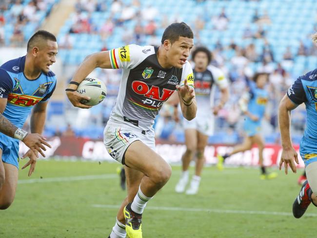 Dallin Watene-Zelezniak of the Panthers (centre) runs with the ball during the Round 22 NRL match between the Gold Coast Titans and the Penrith Panthers at Cbus Super Stadium on the Gold Coast, Saturday, August 11, 2018. Picture: AAP Image/Glenn Hunt