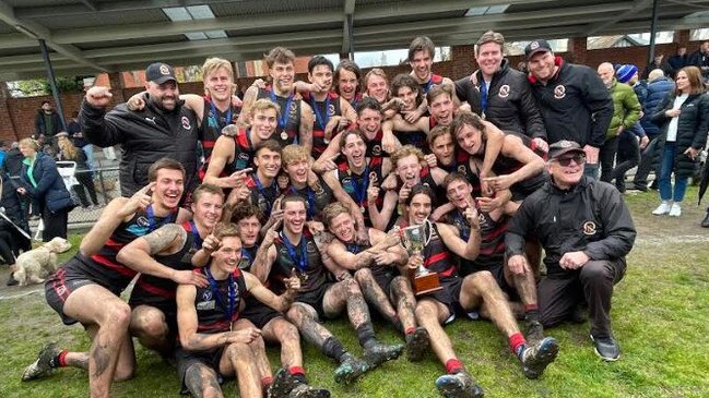 Old Xavs U19s celebrate their title success.