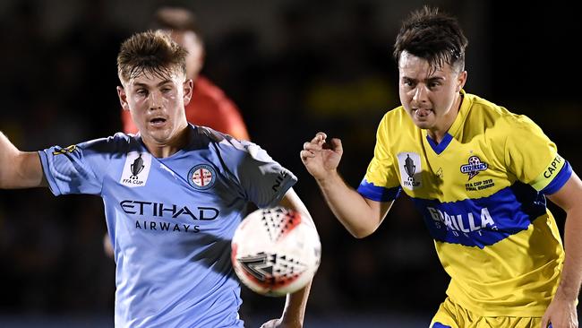 Connor Metcalfe of Melbourne City (left) and Jake McLean of the Strikers. Picture: Getty Images