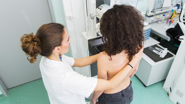 Nurse with young women having a mammography. File photo.