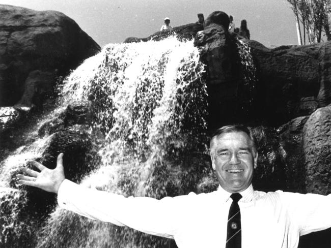 Former Rockhampton Mayor Jim Webber celebrates the reopening of the Kershaw Gardens waterfall in 1990. It had to be rebuilt after collapsing the previous year.