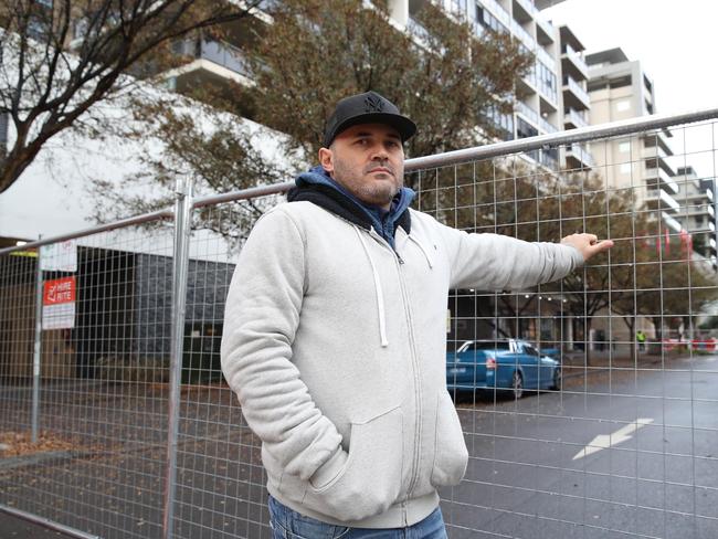 Residents of 1-5 Bourke Street in Mascot are being escorted in and out of the building to collect personal belongings. The residents were evacuated over the weekend after cracks appeared in the building. Pictured is Fabiano Santos. Picture: David Swift.