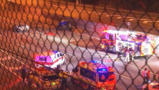 Emergency workers on the scene of Wednesday night’s crash on the Ipswich Motorway. Picture: Channel 9