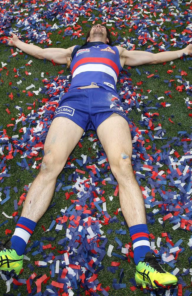 Easton Wood does some snow angels in the confetti. Picture: Michel Klein