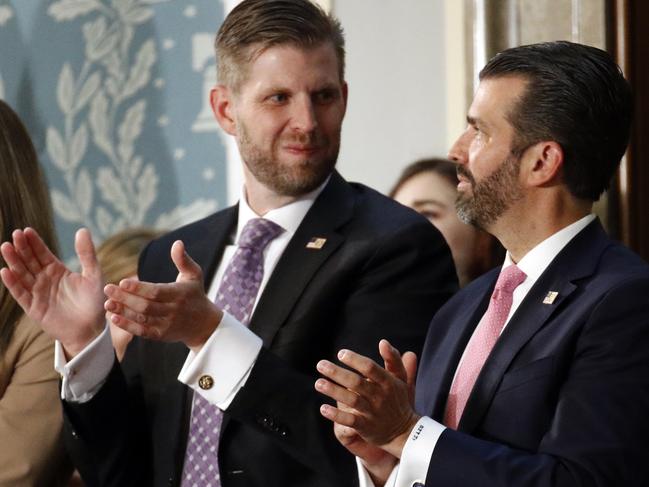 Eric Trump and Donald Trump Jr., listen as President Donald Trump delivers his State of the Union address to a joint session of Congress on Capitol Hill in Washington, Tuesday, Feb. 4, 2020. (AP Photo/Patrick Semansky)