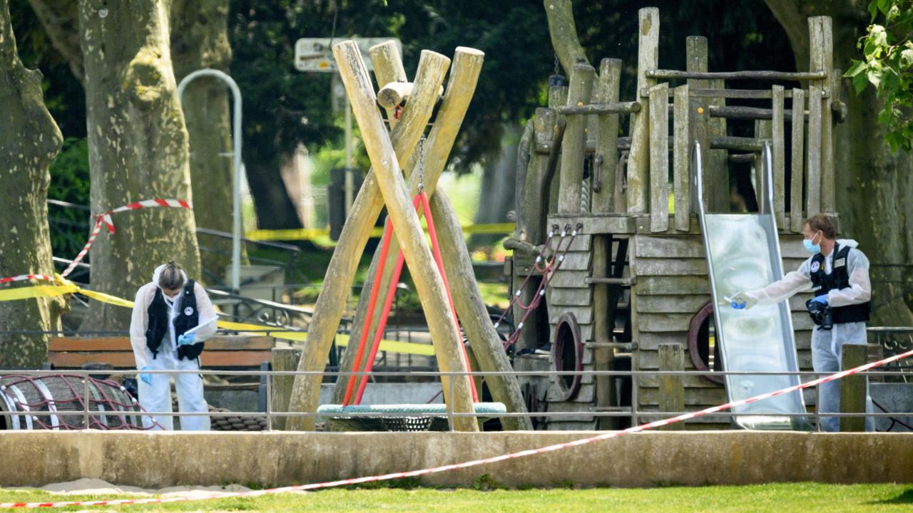 Police officers work inside a cordoned-off area of the children’s playground. Picture: Jean-Christophe Bott/EPA/AAP