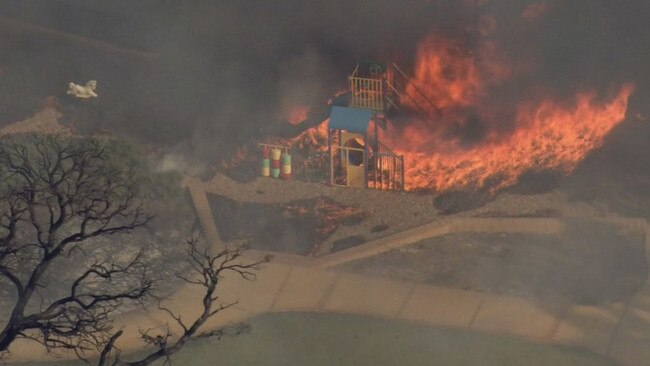 An emergency bushfire in the southern Perth suburb of Piara Waters engulfed a playground close to homes. Picture: 9 News