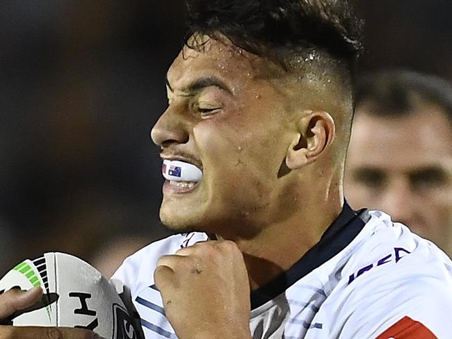 MACKAY, AUSTRALIA - MARCH 02: Tino Fa'asuamaleaui of the Storm is tackled by Coen Hess of the Cowboys during the NRL Trial match between the Melbourne Storm and the North Queensland Cowboys on March 02, 2019 in Mackay, Australia. (Photo by Ian Hitchcock/Getty Images)