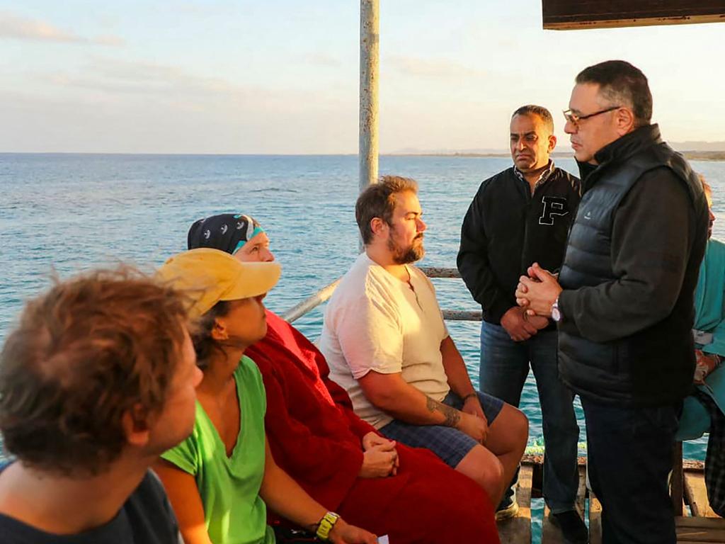 Red Sea governor Amr Hanafi speaking to survivors. Picture: Egyptian sis / AFP