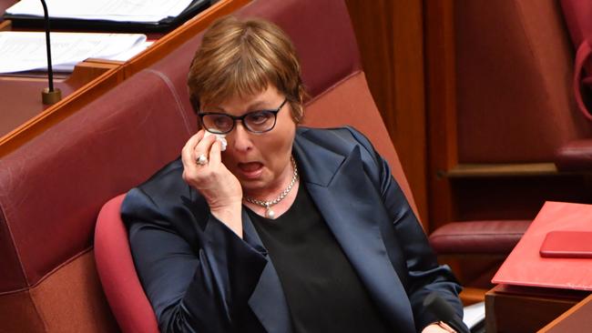 Minister for Defence Linda Reynolds wipes tears from her eye during Question Time in the Senate chamber at Parliament House in Canberra on Thursday. Picture: AAP Image / Mick Tsikas