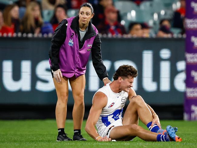 Charlie Comben clutches at his ankle after being injured last year. Picture: Dylan Burns/AFL Photos via Getty Images