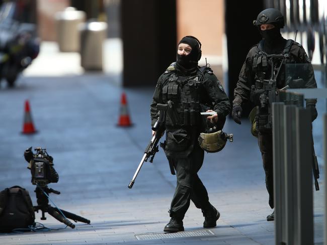 Tactical response officers arrive on scene in Martin Place. Picture: Toby Zerna