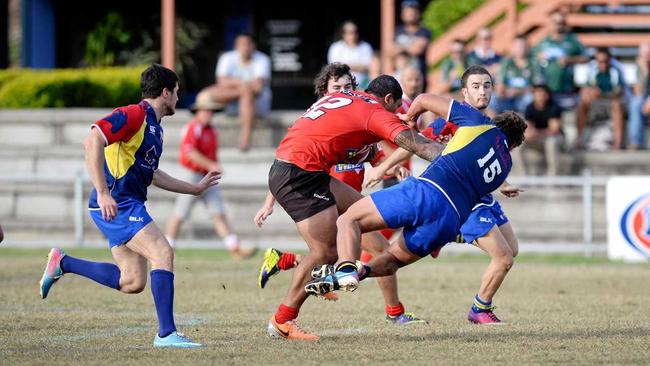 Colts Dylan Tiaaleaiga brushes aside Gladstone defenders.Photo Allan Reinikka / The Morning Bulletin. Picture: Allan Reinikka ROK310514arugby1