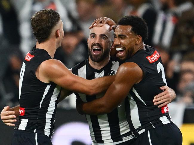 Dan Houston, Steele Sidebottom and Isaac Quaynor celebrate a goal on Friday night.