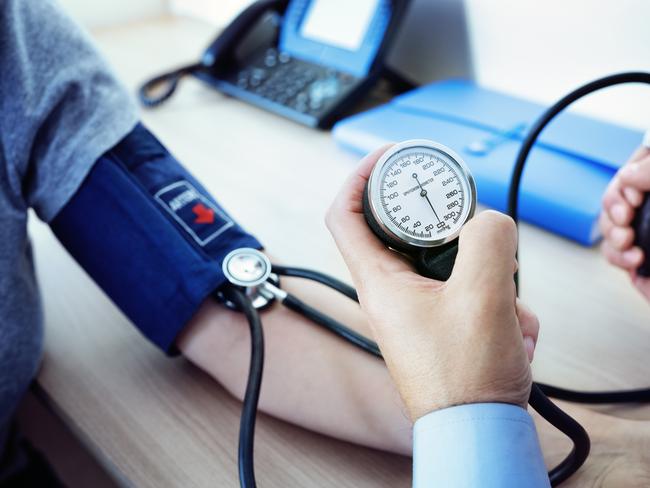 Doctor checking the blood pressure of a patient