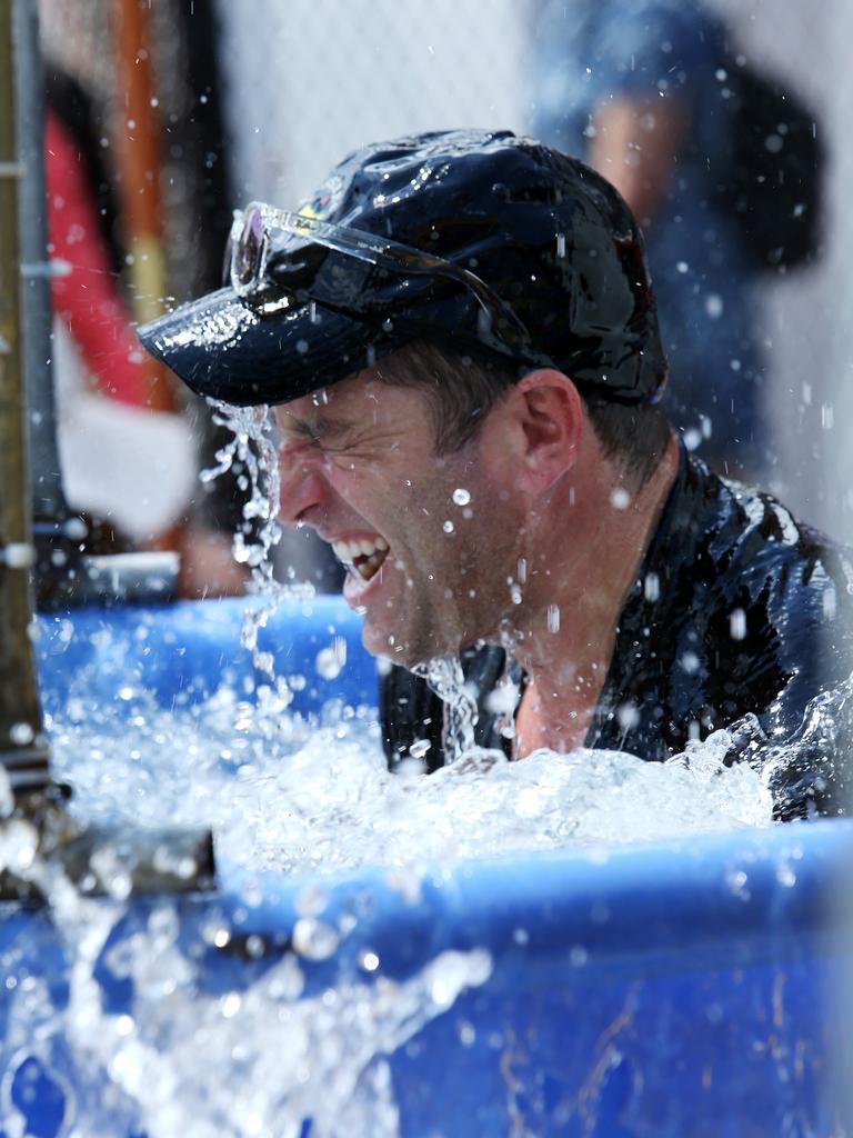 Karl being dunked into a pool of water at a Sydney fair.